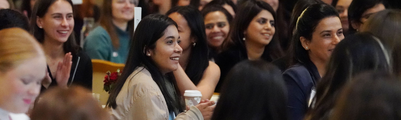 Group of women watching a conference
